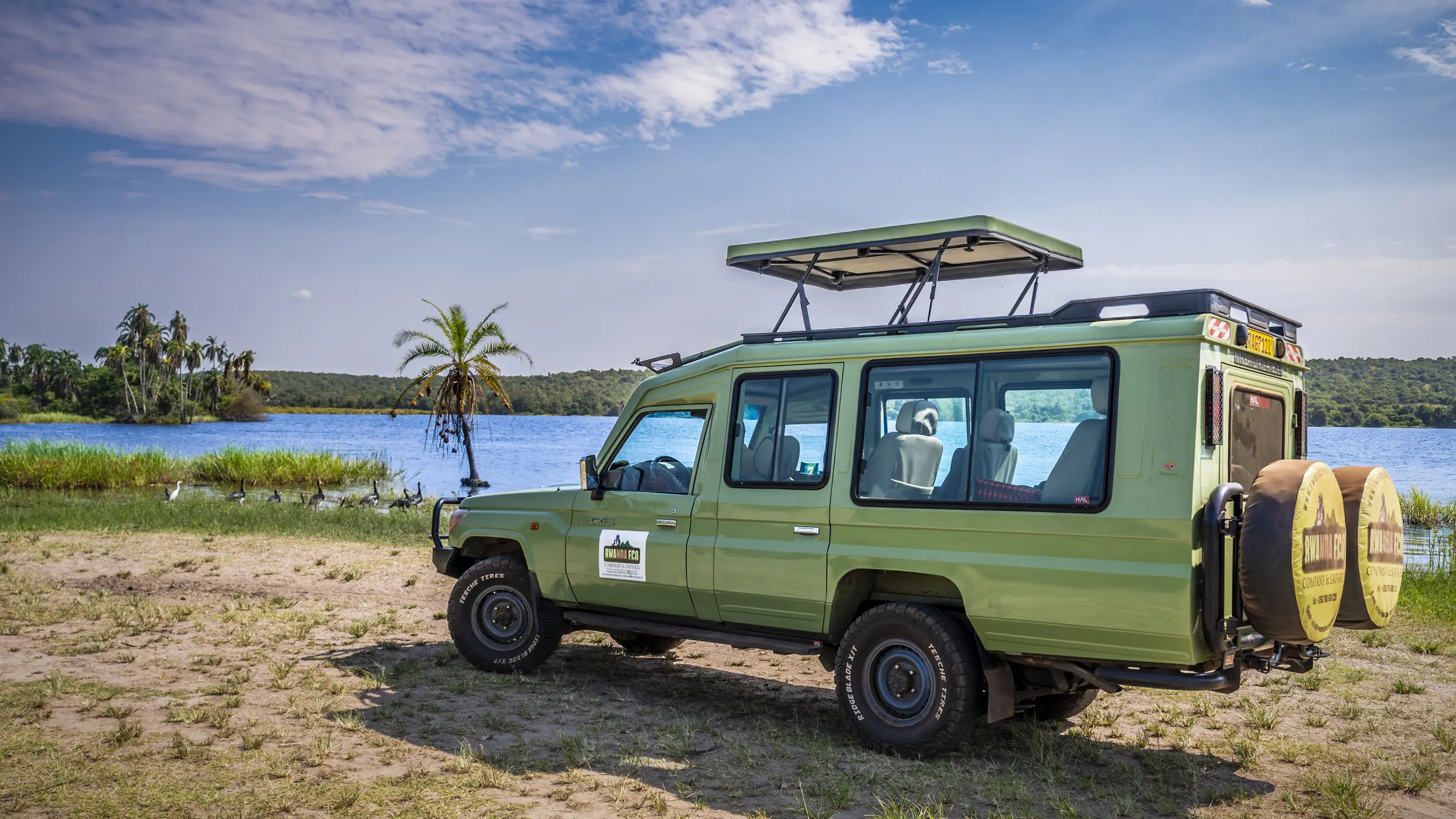 Rwanda Eco Company and Safaris branded safari vehicle at Lake Kivu, Rwanda